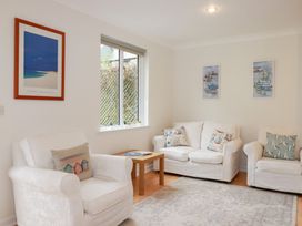 A living room with sofas and a coffee table at Acorns in Falmouth
