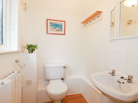 A bathroom with a sink and toilet at Acorns in Falmouth