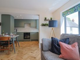 A kitchen with seating and modern appliances at 1 Mill Green Court in Lyme Regis