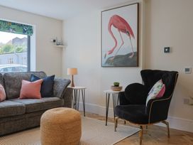 A living room with a sofa and side table at 1 Mill Green Court Lyme Regis