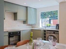A kitchen with a sink and oven at 1 Mill Green Court Lyme Regis
