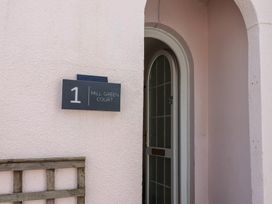 An entrance with a door and nameplate at 1 Mill Green Court in Lyme Regis