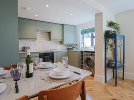A kitchen with a dining table set at 1 Mill Green Court Lyme Regis