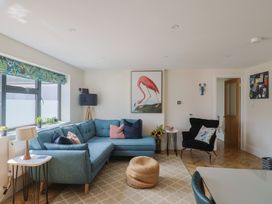 A living room with a sofa and coffee table at 1 Mill Green Court in Lyme Regis
