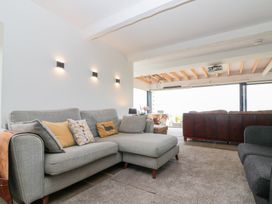 A living room with a sofa and coffee table at Sea Haven in Hunmanby Gap near Primrose Valley
