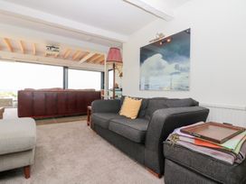 A living room with a sofa and armchair at Sea Haven Hunmanby Gap near Primrose Valley