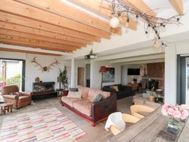 A living room with a sofa and armchair in Sea Haven near Hunmanby Gap