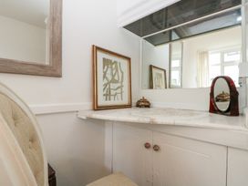 A dressing area with a vanity and mirror at Sea Haven, Hunmanby Gap near Primrose Valley