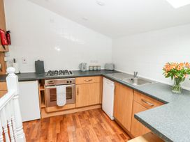 A kitchen with appliances and a sink at Bobby's in Whitby