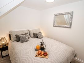 A bedroom with a bed and breakfast tray at Bobby's in Whitby