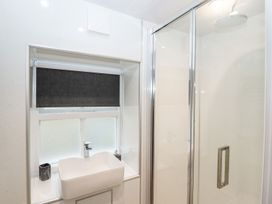 A bathroom featuring a sink and shower at Bobby's in Whitby