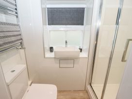 A bathroom with a sink and shower at Bobby's in Whitby