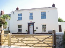 A house with an entrance and gate at Littleham Court Manor Littleham near Bideford