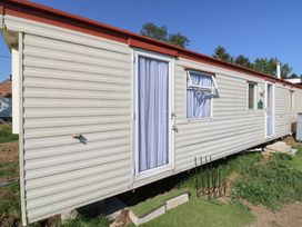 A mobile home with a door and windows in Northampton