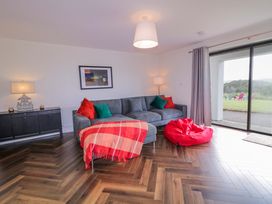 A living room with a sofa and bean bag at Ard Na Mara
