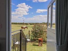 An outdoor view with a horse in a garden at Wolds Hoot in Market Weighton