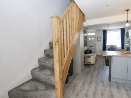A hallway with a staircase leading to the upper floor at Keekle Terrace in Cleator Moor