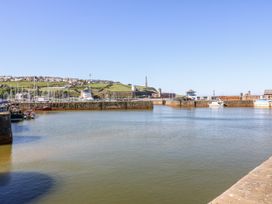 A harbor with boats and buildings at Keekle Terrace in Cleator Moor