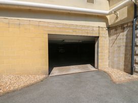 A garage opening with a concrete floor at Pears Suite in Whitehaven
