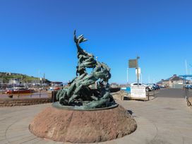 A sculpture near a harbor in Whitehaven