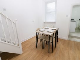 A dining room with a table and chairs at Holly House in Waberthwaite