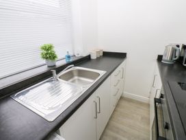 A kitchen with a sink and counter space at Holly House Waberthwaite