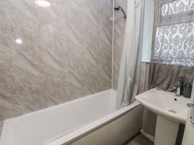 A bathroom with a bathtub and sink at Lonsdale Street