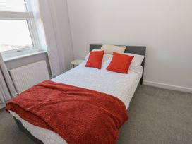 A bedroom with a bed and pillows at Lonsdale Street 