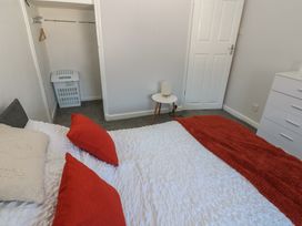 A bedroom with a bed and wardrobe at Lonsdale Street