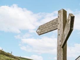A signpost indicating trails at Sandpiper St Bees