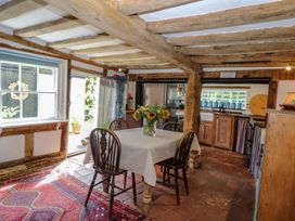 A dining room with a table and chairs at Bank House