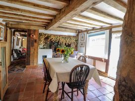 A dining room with a table and chairs at Bank House
