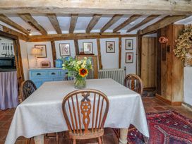 A dining room with a table and chairs at Bank House