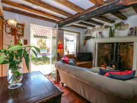 A living room with a sofa and a television at Bank House in 