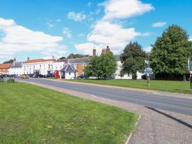 A street with buildings and trees at Bank House