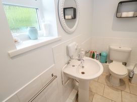 A bathroom with a sink and toilet at Mini Mena in St Austell