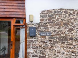 Exterior view of Church Barn with window and stone wall in Sutcombe near Bradworthy