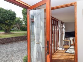 An indoor area featuring a television and seating at Church Barn Sutcombe near Bradworthy