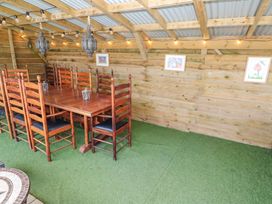 A dining room with a table and chairs at Five Elements Barn St Agnes