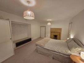 A bedroom with a bed and nightstand at 46 North Street in Stoke-Sub-Hamdon, Somerset