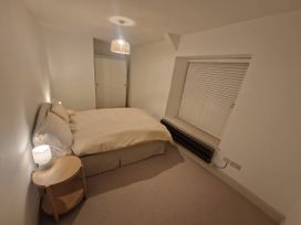 A bedroom with a bed and nightstand at 46 North Street in Stoke-Sub-Hamdon Somerset