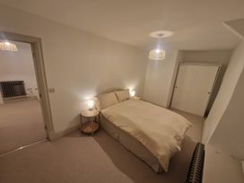A bedroom with a bed and wardrobe at 46 North Street, Stoke-Sub-Hamdon, Somerset