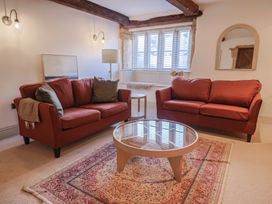 A living room with two sofas, a coffee table and a rug at 46 North Street Stoke-Sub-Hamdon Somerset