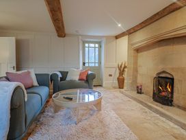 A living room with a sofa and fireplace at 46 North Street Stoke-Sub-Hamdon, Somerset