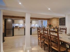 A kitchen with appliances and a dining area at 46 North Street Stoke-Sub-Hamdon, Somerset
