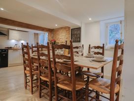 A dining room with a wooden table and chairs at 46 North Street Stoke-Sub-Hamdon Somerset