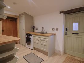 A utility room with a washing machine and sink at 46 North Street Stoke-Sub-Hamdon Somerset