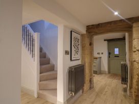 A hallway with a staircase and a door at 46 North Street Stoke-Sub-Hamdon, Somerset