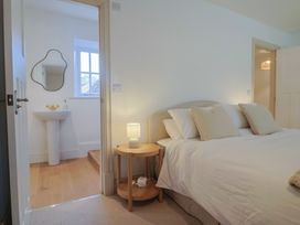 A bedroom featuring a bed and bedside table at 46 North Street, Stoke-Sub-Hamdon, Somerset