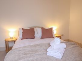 A bedroom with a bed and towels at 46 North Street, Stoke-Sub-Hamdon, Somerset